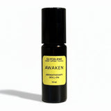 Aromatherapy roll-on bottle labeled 'Awaken' by Glyceleene on a white background small