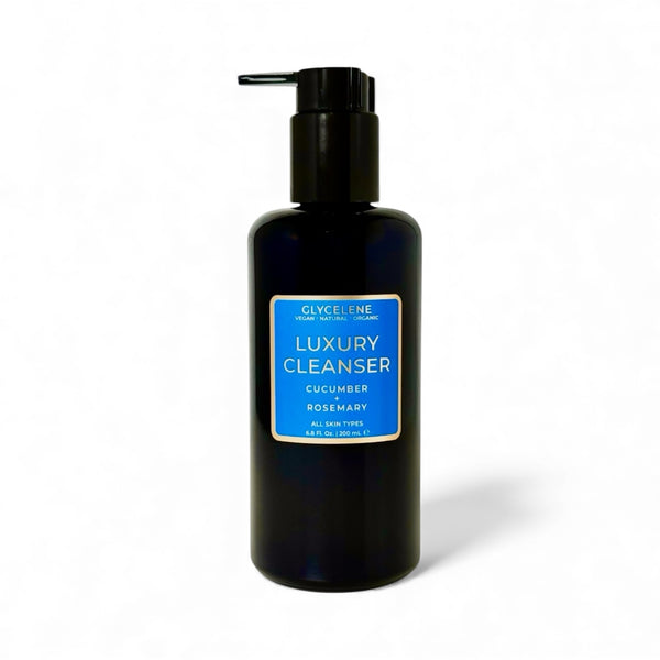 Black bottle of luxury cleanser with a blue label on a white background