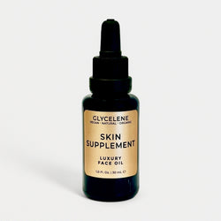 Bottle of Glycelelene skin supplement luxury face oil on a white background